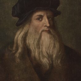 Pictura cu Leonardo da Vinci, din aproximativ anul 1500. Are barba albă lungă, poartă o pălărie și haine maro. Fundal maro închis. Experții vor să studieze ADN-ul lui Leonardo da Vinci