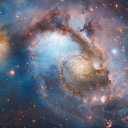 Galaxie de stele, în nuanțe de albastru, cu lumini galbene. Cea mai rapidă stea a fost descoperită lângă gaura neagră din centrul Căii Lactee